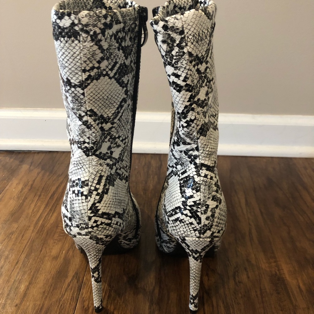 Women’s faux snake leather  bootie. NEVER WORN.